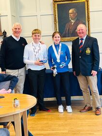 Archie Cole and Olivia barker-Sabido of Brookfield School in Chesterfield pictured with Chevin GC Captain Chris Crowther